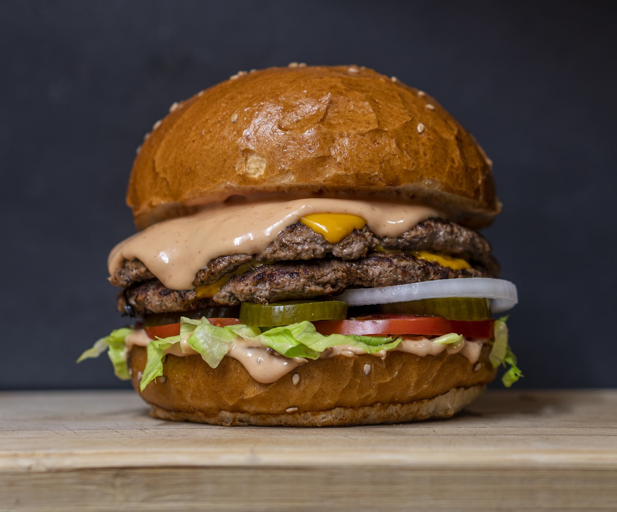 Double smash burger with melting cheese and house sauce